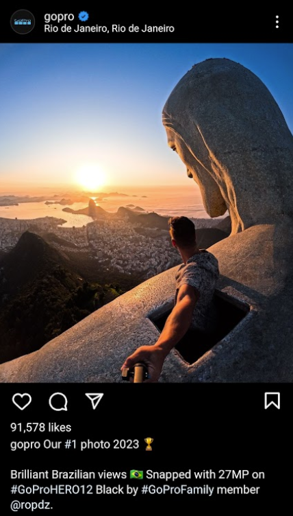 gopro instagram post on man on top of statue